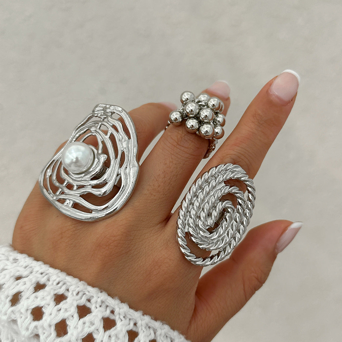 Geometric ripple imitation pearl ring, irregular elliptical alloy winding ring