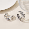 This multi-layered C-shaped earrings exude a sense of high-end sophistication and are versatile in style